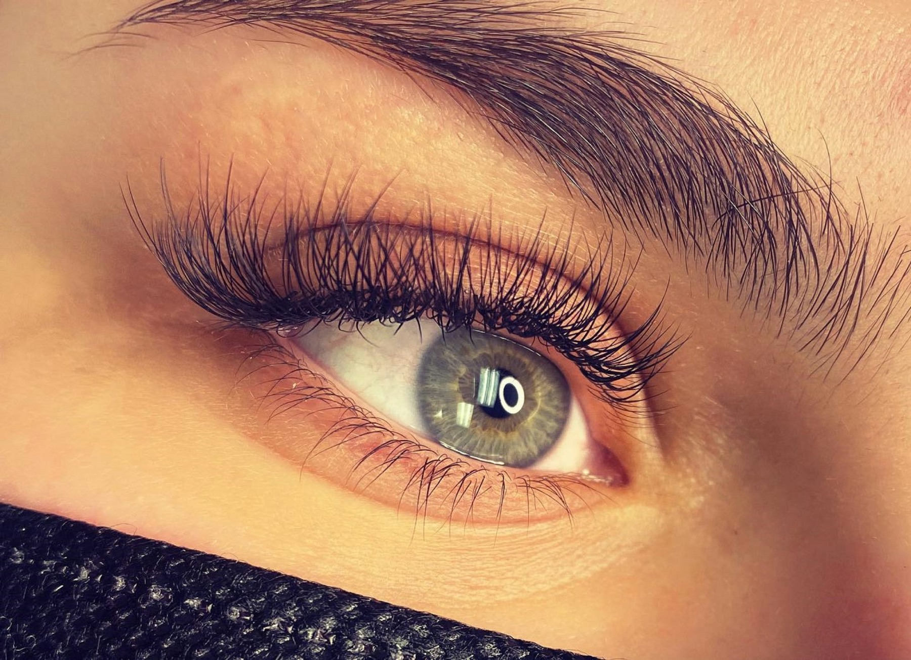Close-up of an eye wearing soft, fluttery lash extensions